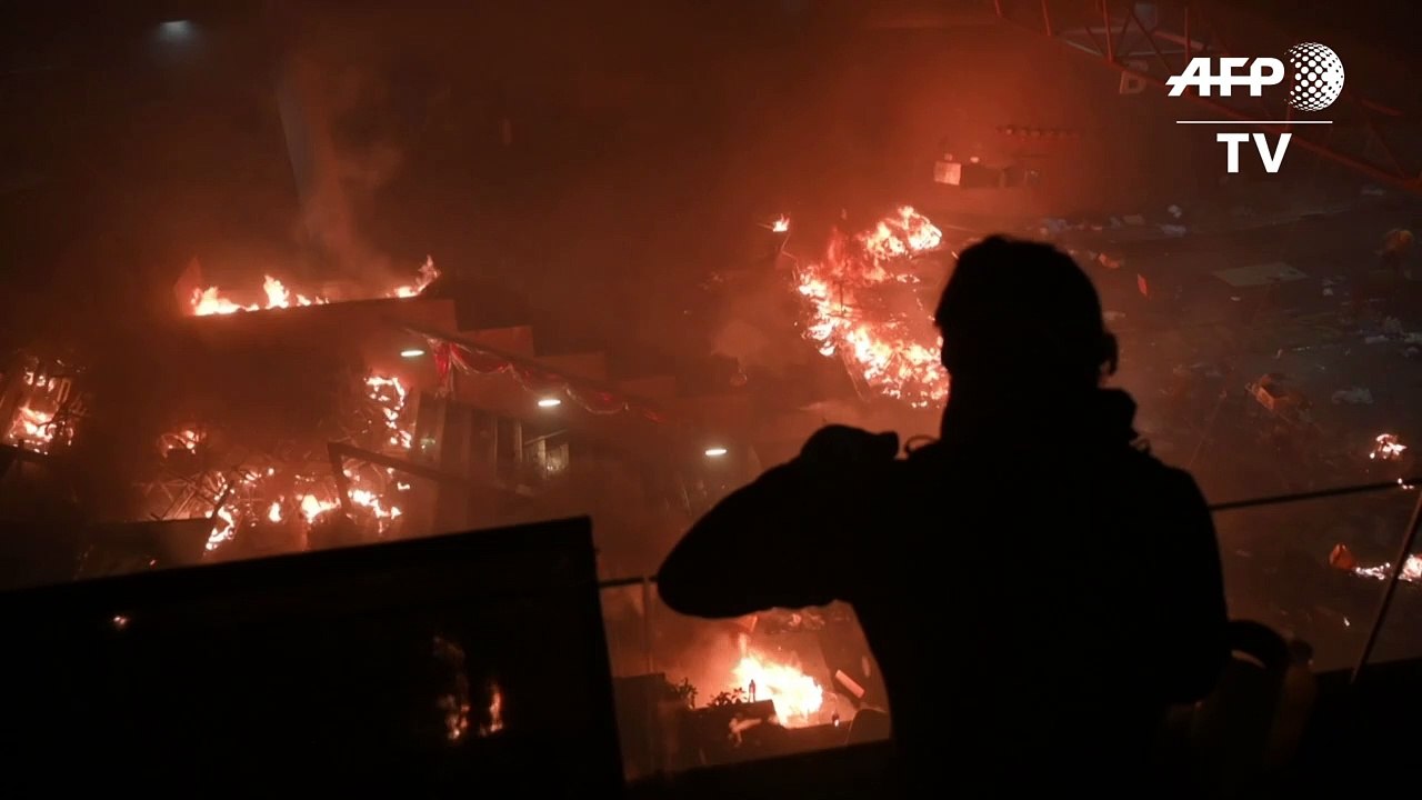 Fire rages at Hong Kong campus entrance as protesters fend off police: AFP
