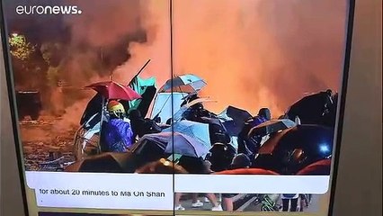 Hundreds of protesters leave university under siege by Hong Kong police