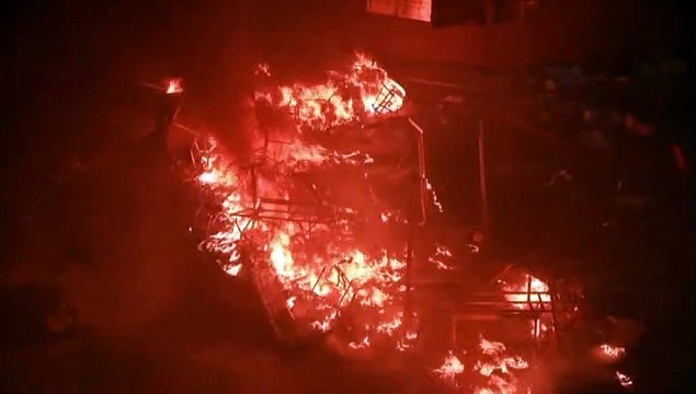 Fire rages at Hong Kong campus entrance as protesters fend off police - AFP