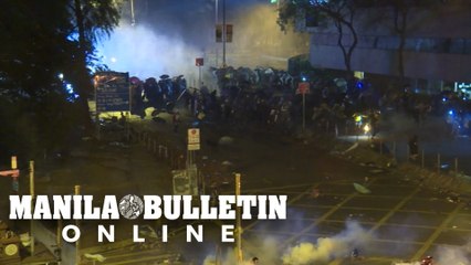Protesters set fire to hold off police at Hong Kong campus