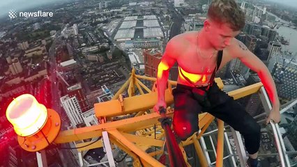 Heart-stopping moment daredevil documents himself standing on top of 200-metre crane in London without safety ropes