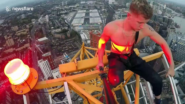 Heart-stopping moment daredevil documents himself standing on top of 200-metre crane in London without safety ropes