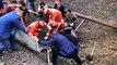 Chinese firefighters rescue worker out after he was buried in gravel due to rockslide
