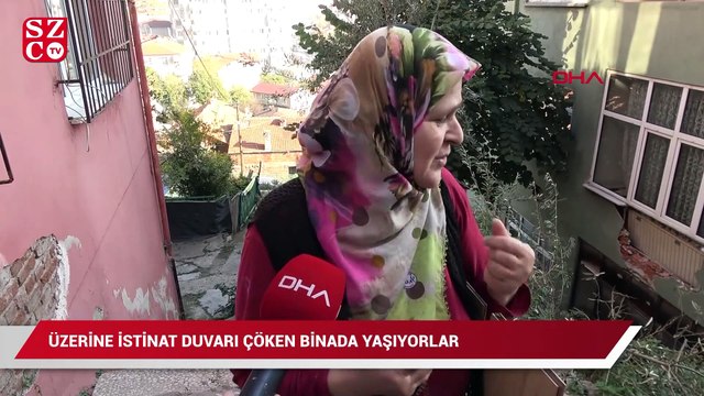 Üzerine istinat duvarı çöken binada yaşıyorlar