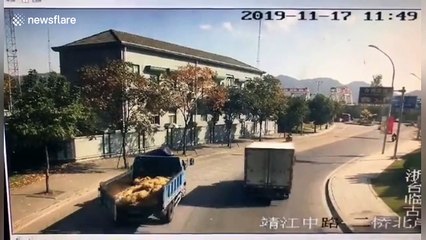 Helmet saves Chinese biker's life after he and his son were struck down by truck trailer's loose backdoor