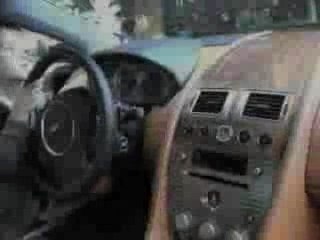 Black Aston Martin DB9 Being Revved Hard