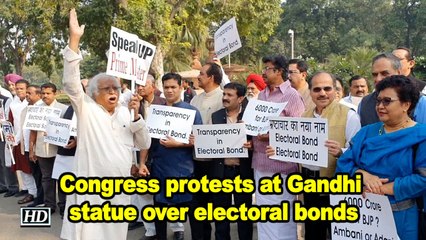 Congress protests at Gandhi statue over electoral bonds at Parliament House