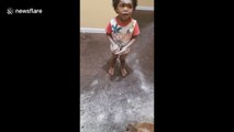 Hilarious moment naughty child covers himself and his house in clay powder