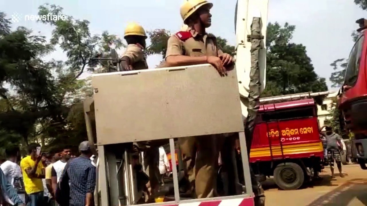 Allegedly unstable man rescued from rooftop in east India after threatening to jump