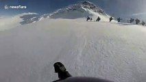 Georgian skier films avalanche escape when slope gives way underneath him