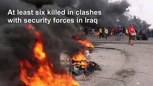 Iraqis burn tyres to block a road in the port city of Basra (2)