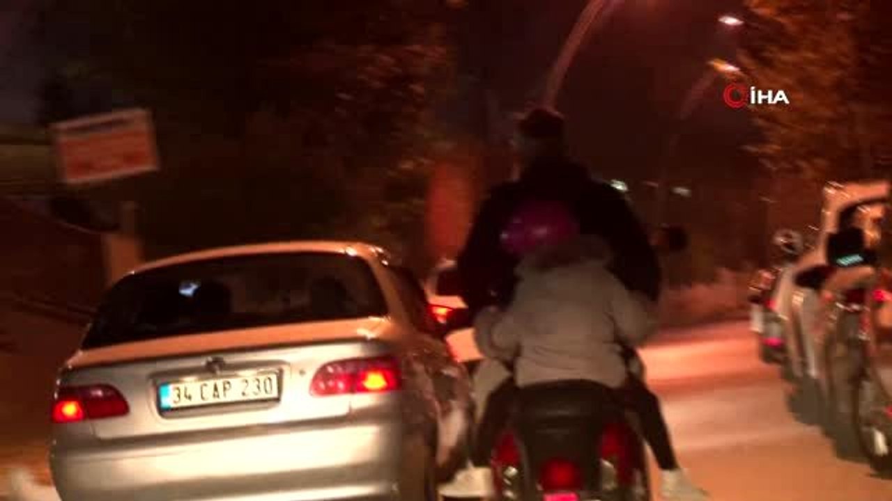 Küçük çocuğun motosiklet üzerindeki korku dolu yolculuğu kamerada