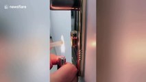 Chinese woman shows ingenious way she removes broken key from a lock using glue