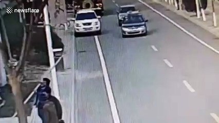 Worker in China accidentally impales steel pipe into passing taxi