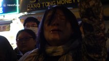 Protester cries as she chants outside Hong Kong's Polytechnic University