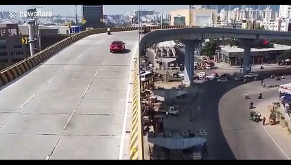 New footage shows moment speeding car plummets off flyover into crowd in India