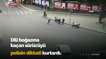 Dili boğazına kaçan sürücünün hayatını polis kurtardı