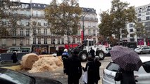 French farmers use tractors to blockade Champs-Elysees in Paris to protest against 'agri-bashing'
