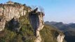 Top-heavy rock in China still standing after thousands of years