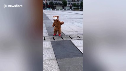 Chinese toddler finally overcomes fears and walks across drain