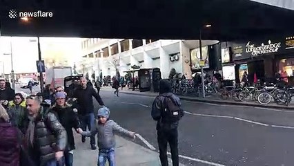 Crowds of people flee after 'man shot' on London Bridge