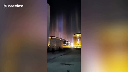 Reflections from ice crystals in the air create 'light pillars' to form above Chinese city