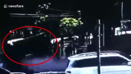 Huge sinkhole opens up on road in southern China