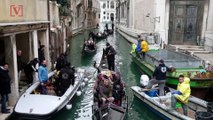 Scuba Divers Help Clean Up Venice Canals After Historic Flooding