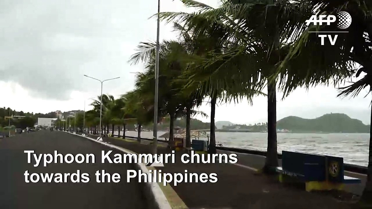 People take shelter as Typhoon Tisoy churns tow...