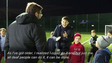 Football coach proves deafness is no hindrance to career on the touchline