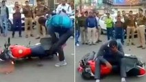 Man throws bike, breaks down after being fined for not wearing helmet | Oneindia Malayalam