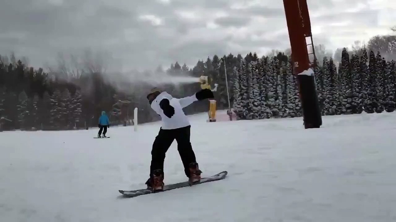Snowboarder Attempts A Backflip And Fails