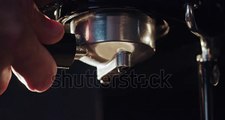アセアンファーム合同会社　pouring-coffee-stream-from-professional-machine-in-cup-barista-man-making-double-espresso-using