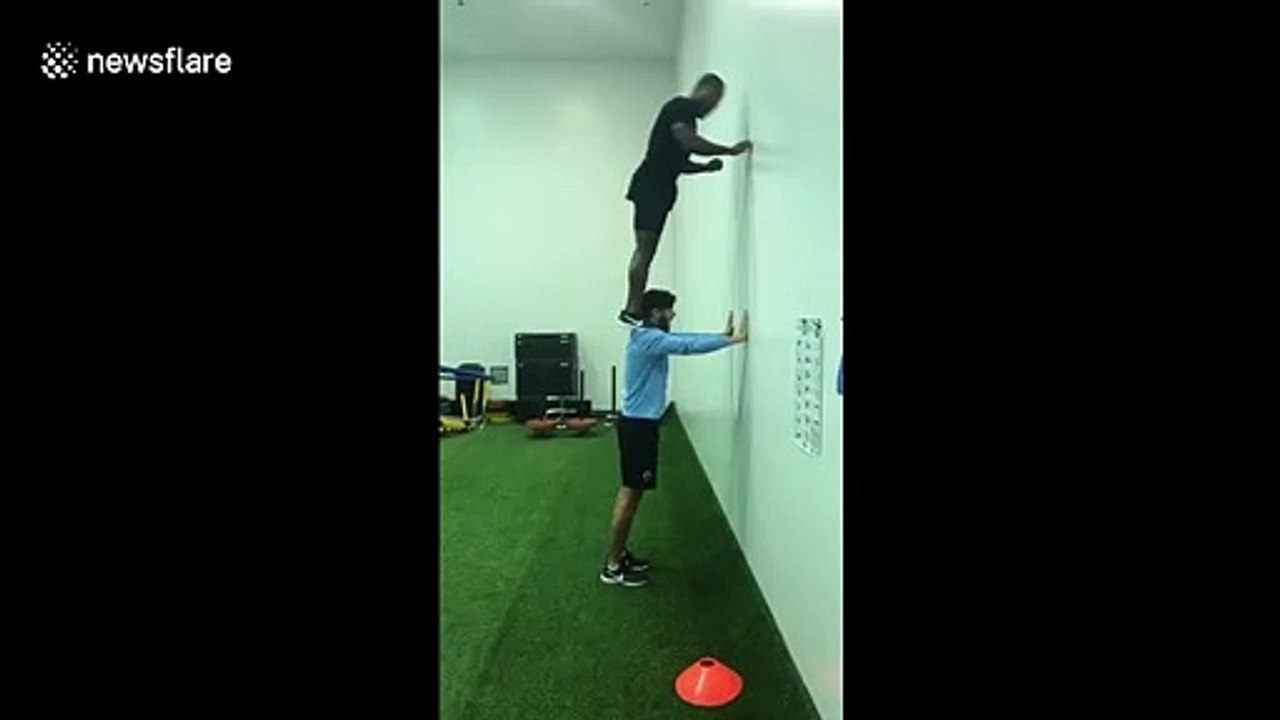 US 5ft6 parkour athlete executes running vertical leap onto shoulders of 6ft4 friend