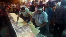 People Gathered Around Restaurant Cheffs Preparing Longest Sandwich Shawerma On Street Tables