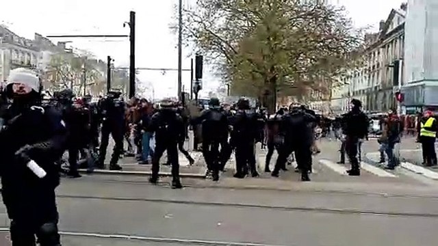 Policeman throws woman to the ground as protests against retirement reform paralyse France