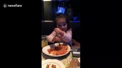 Little girl in California has unique way of eating spaghetti