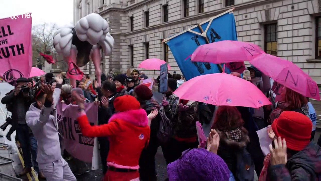 Climate activists place four-metre tall ostrich statue outside Conservative and Liberal Democrat party headquarters