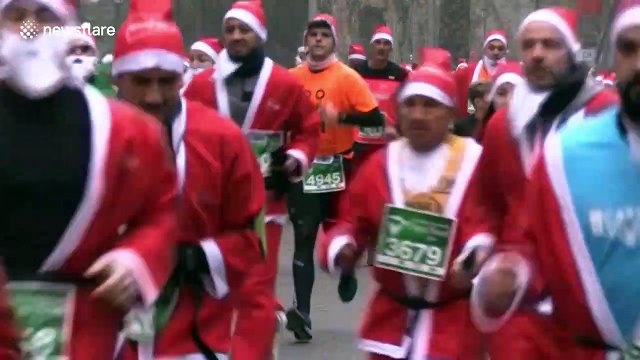 Thousands of Santas race through Spanish capital to raise money for charity