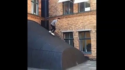 Skateboarder Rides Down Ramp And Fails
