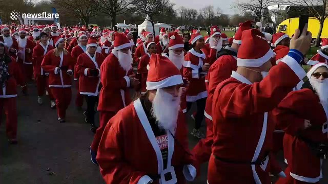 Thousands of Santas run through London park for charity