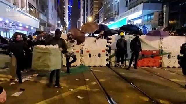 Hong Kongers light up streets with glowing mobile phones as protesters rally again in their thousands
