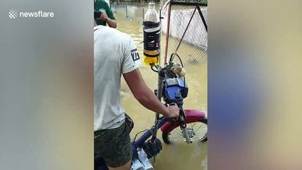 Mechanics have wacky modified motorcycle for riding through floods