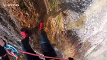 Don't look down! Man abseils down huge canyon waterfall in Austria