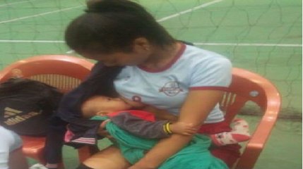 Mizoram volleyball player breastfeeds baby during half time