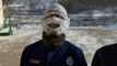 Firefighters' face masks covered in snow after they train outside in sub-zero temperatures