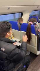 Passenger Hangs Phone From Hair