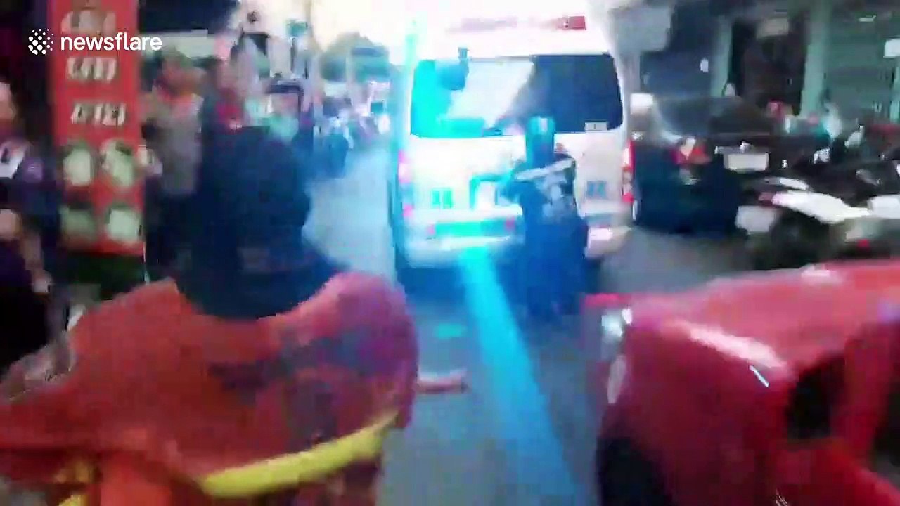 Dramatic moment fireman carries toddler out of burning building in Bangkok