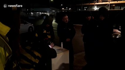 Climate activist dressed as a bee glued to fridge outside Boris Johnson's speech venue