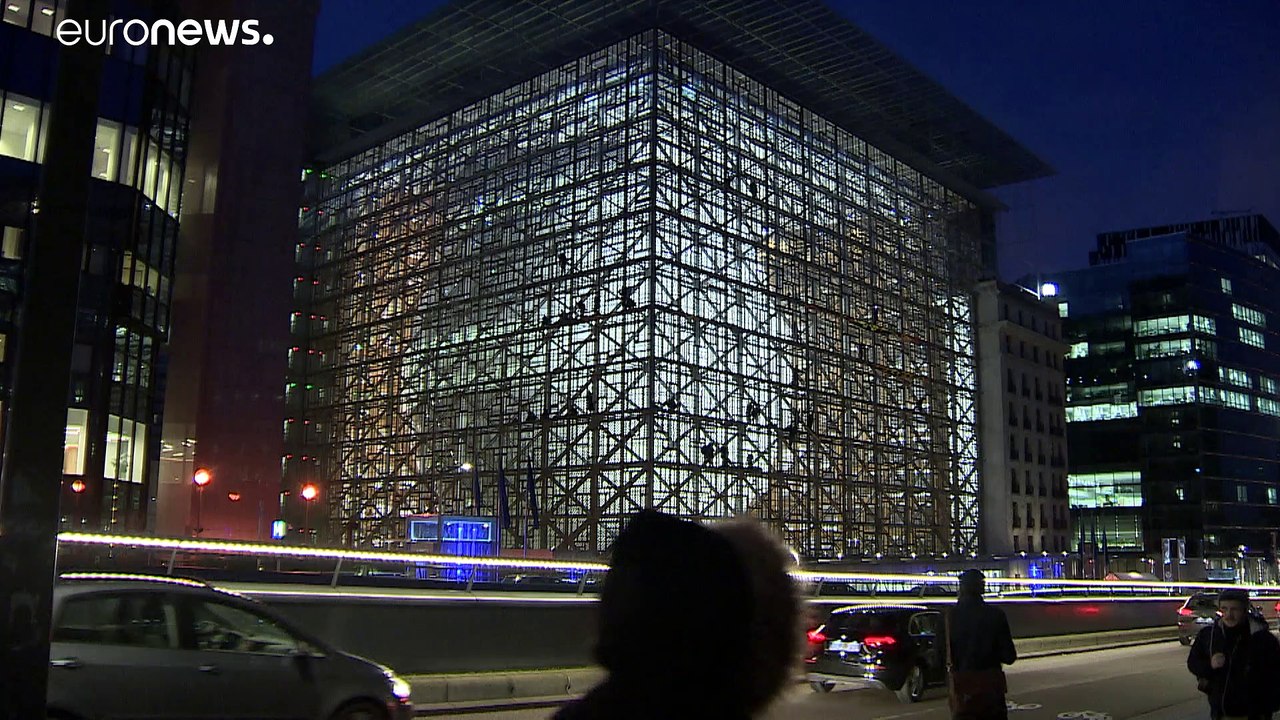 Greenpeace hang Climate Emergency banner at new EU headquarters